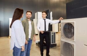 Salesman talking to homeowners about a new HVAC system